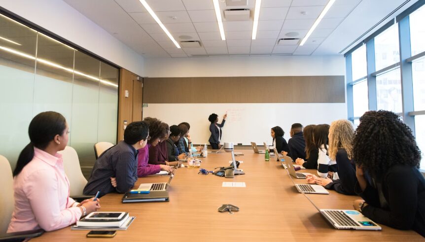 Photograph of adults networking around a table