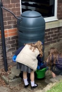 Child using water butt